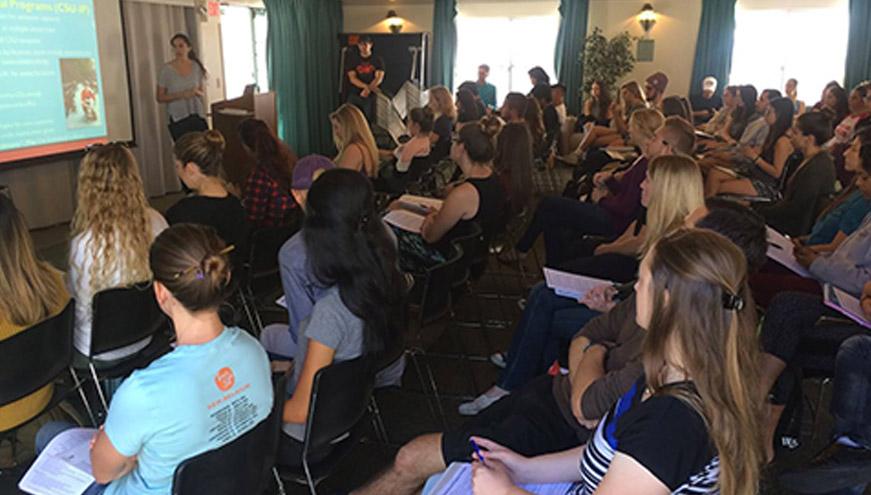 Students listening at a study abroad information session.